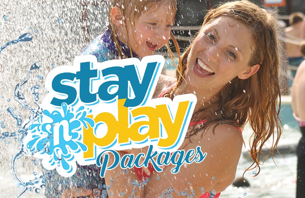 The stay 'n play logo. In the background of the picture are two guests smiling.