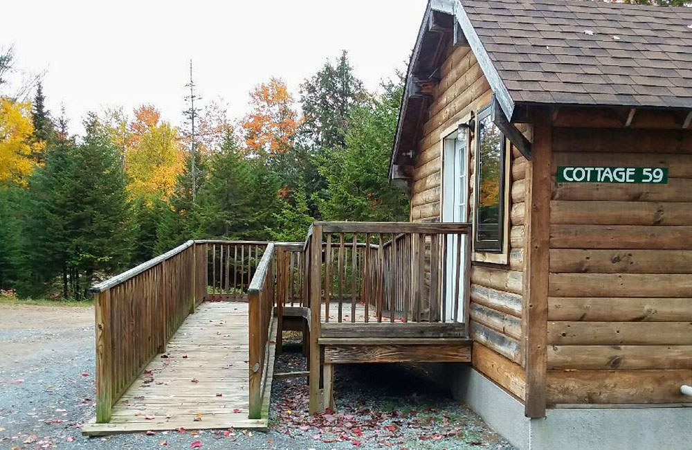 wooden cottage. outside, trees